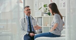 A woman is having a consultation with her doctor for her treatment doctor explaining the difference between BS vs celiac disease - Monmouth Gastroenterology - Monmouth Gastroenterology
