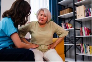 Woman having a medical exam with her doctor and consulting about her abdominal pain causes - Monmouth Gastroenterology - Monmouth Gastroenterology